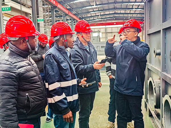 ACE Group engineers explaining high-precision welding standards for asphalt mixing equipment